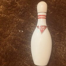 Spilla da bowling Avon. Colonia uomo anni 60. 1 palo da barbiere. 2 oggetti.