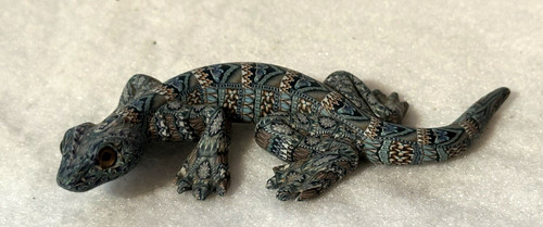 Scultura figura lucertola