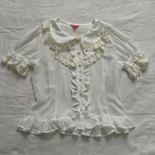 Blusa manica corta con volant