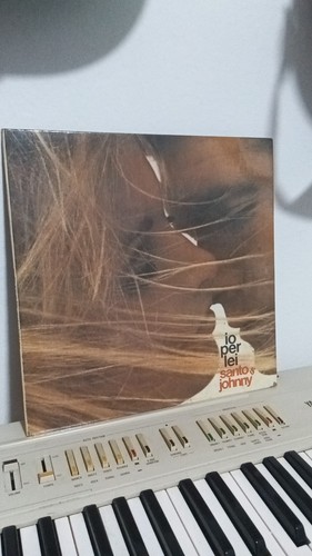 Santo johnny io per - &,