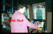 woman playing 4 reel Bally