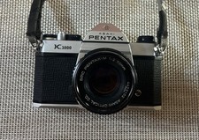 Pentax K1000 fotocamera 35 mm, obiettivo zoom 200 mm, flash e custodia per il trasporto