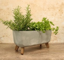 Fioriera vaso con gambe design