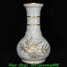 Vaso bottiglia fiori dorata