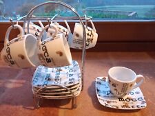 Set 6 Tazzine Caffè complete di piattini e supporto in acciaio.