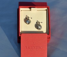 Orecchini a clip con polsini