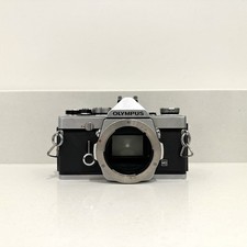 Olympus OM1 fotocamera reflex pellicola 35 mm - testata e funzionante! (Ha bisogno di un po' di amore e attenzione)