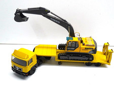 Conrad MAN F2000 F90 escavatore cingolato a pianale ribassato Zeppelin 1:50 + Volvo EC210 1:87?