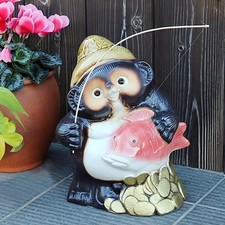 Statua cane procione