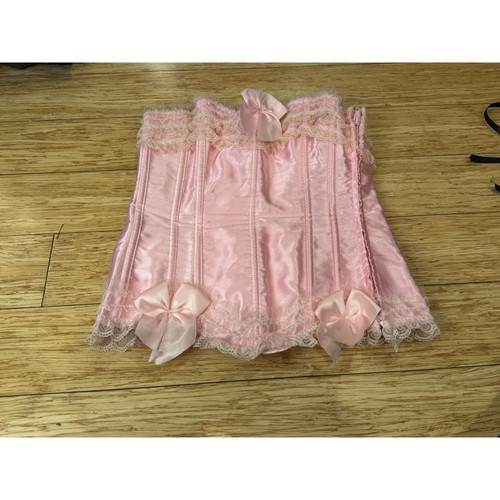Corsetto rosa sopra busto