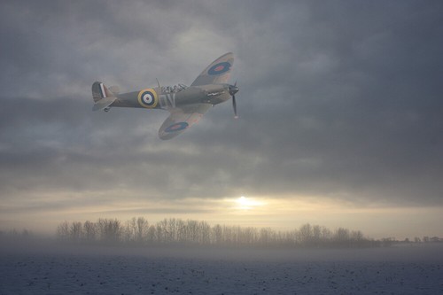 Spitfire mk1a over fields