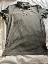 Polo Moncler grigia logo toppa