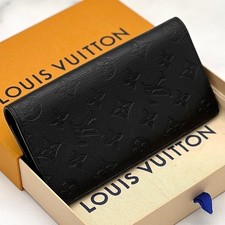 Portafogli Louis Vuitton: Monogram Shadow Portafogli Brazza Nero con scatola
