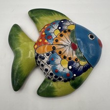 Green And Blue Fish Hand