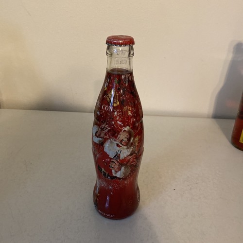 Bottiglia avvolta coca - coca, cola