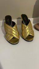 Mules Gucci oro