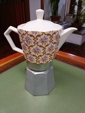 Caffetteria  in Porcellana  e Alluminio.