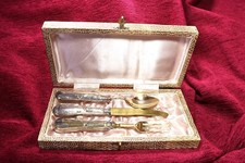 Tre posate in ottone. Custodia