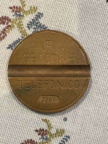 Gettone telefonico con - , segni