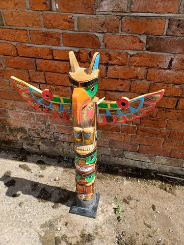 Large totem pole - pole, hand