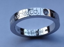 TIFFANY ANELLO ORO BIANCO CON TRE DIAMANTI NATURALI,COME NUOVO DIAMETRO CM 1,7.