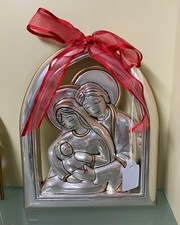 Capezzale in argento Sacra