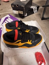Air Jordan 4 RM Giallo e Nero