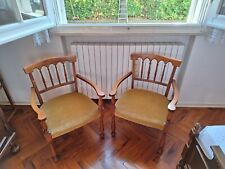 Poltroncine in legno di noce con braccioli