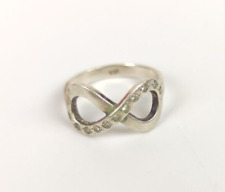 ANELLO IN PLATINO PT 950 INFINITO CON ZIRCONI INFINITY