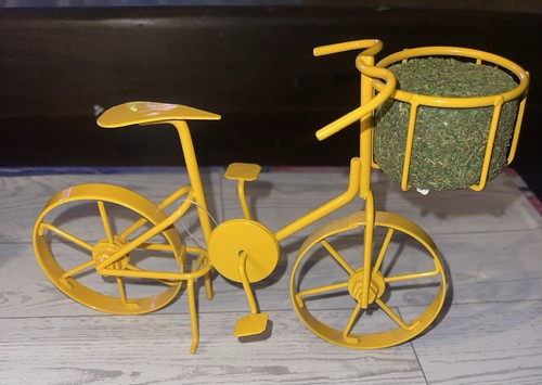 Statuina bicicletta gialla