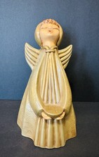 Statuina angelo cantante stile