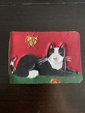 Fermasoldi in pelle lavorata a