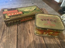 SCATOLE DI LATTA PUBBLICITARIE ZUEGG E ZEDA EPOCA  ORIGINALI 1940