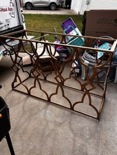 Tavolo consolle in metallo dorato con piano a specchio anticato