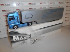 CNR66158 by CONRAD MAN TGA XXL WITH TRAILER BLUE MET. 1:50