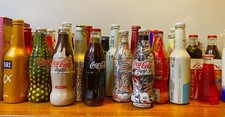 bottiglie coca cola E Lattine
