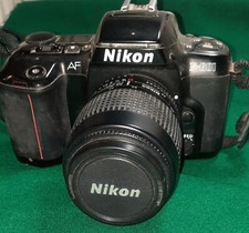 FOTOCAMERA NIKON F-601, obiettivo 35-80,FLASH NIKON SB-22 CON MANUALI ORIGINALI