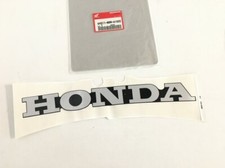 64311-MBW-A10ZC ADESIVO