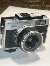 Fotocamera mirino automatica