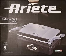 Griglia a contatto  con piastre removibili  e coperchio basculante.