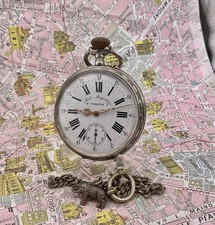 Vedette .  OROLOGIO TASCA Argento . Ancora 15 rubis . 1900 . Con catena metallo