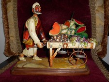 SCULTURA MERCANTE VENDITORE DI