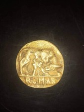 medaglione romano . inciso un lupo con 2 uomini e l'altro verso un testa 