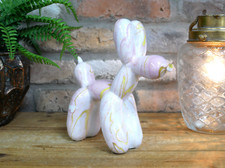 Statua astratta rosa e oro