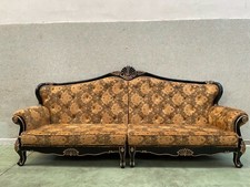 divano stile barocco, colore oro e nero. con rifiniture in nero lucido