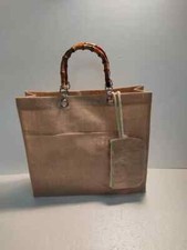 BORSA IN JUTA NATURALE COLORATA CON MANICI IN BAMBU' E POCHETTE MODELLO "PARODI"