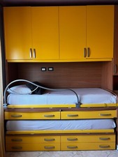 cameretta Moretti 2 posti letto . Completa di lampadario, scrivania, tenda, box.