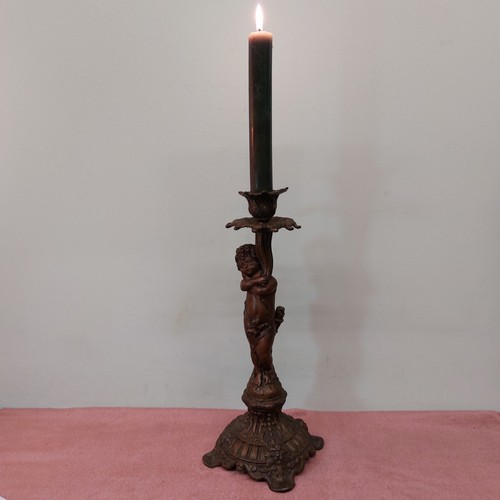 Candelabro con putto