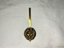 balancier de  pendule portique