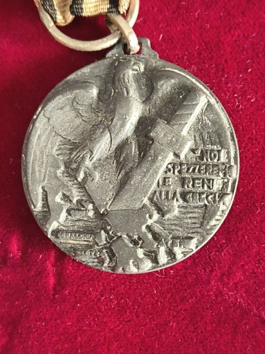 Medaglia spezzeremo reni - le,